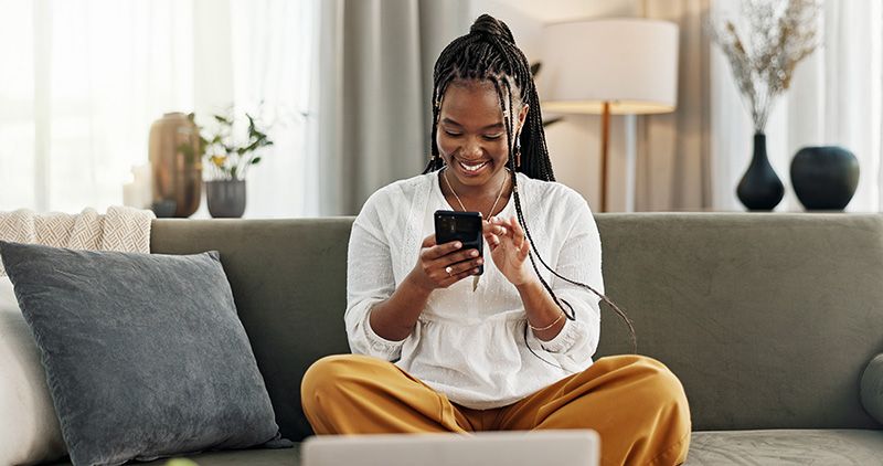 Woman looking at investing information on phone
