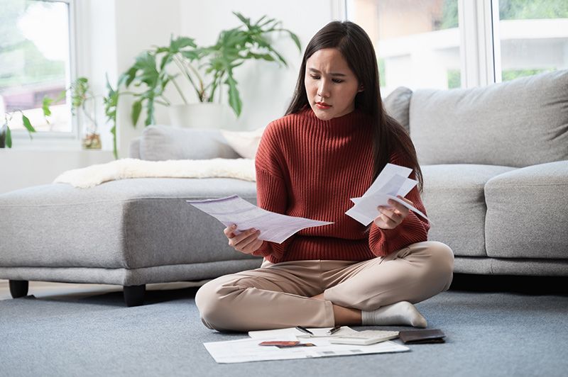 Person looking through bills